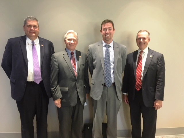 Dr. Ryan Squier center right meets with members of the HOPES Task Force left to right Reps. Scott Ryan Stephen Hambley and Robert Sprague